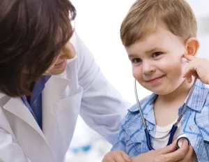 A child learning use of stethoscope