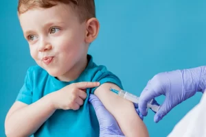 A child getting a Vaccine dose