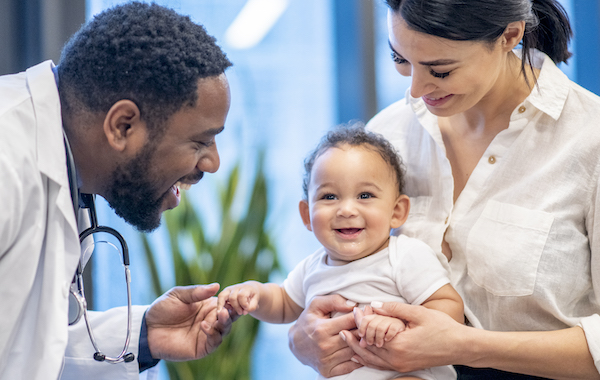 Mother brings in her mixed race son for a wellness checkup